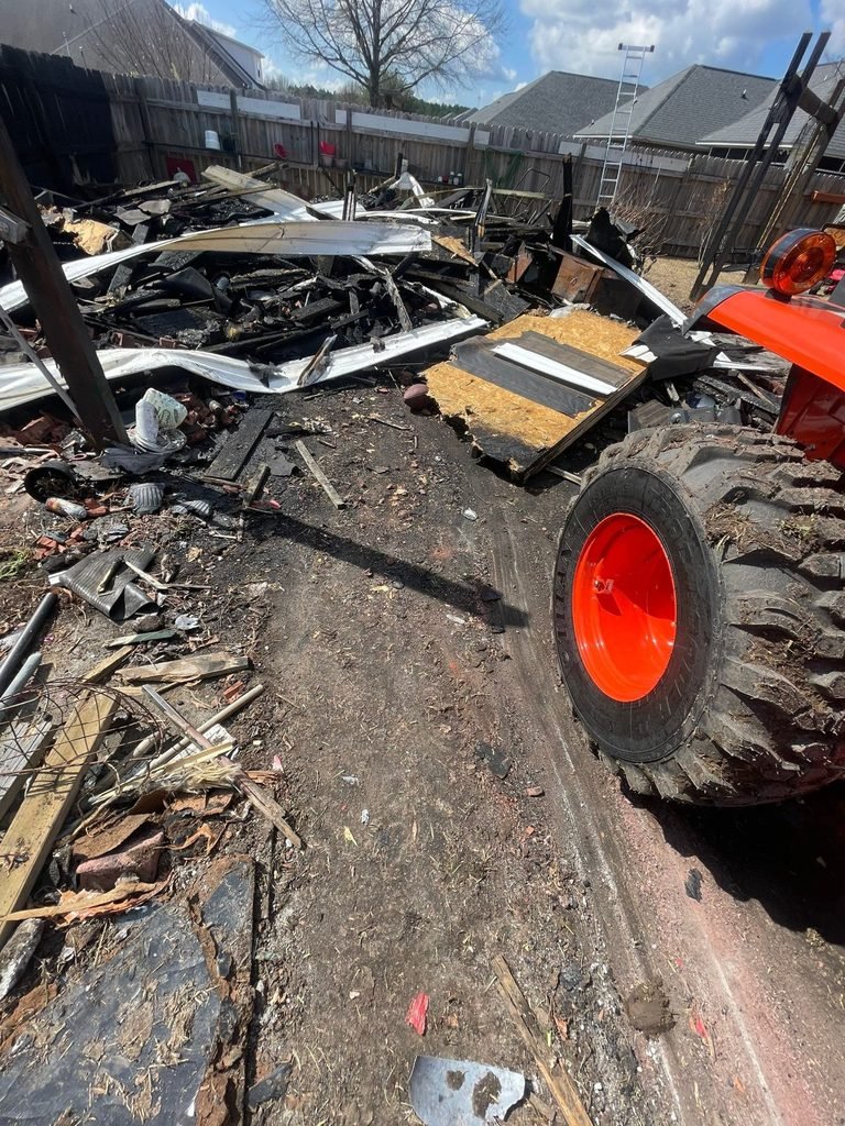Fire debris removal and demolition with heavy equipment